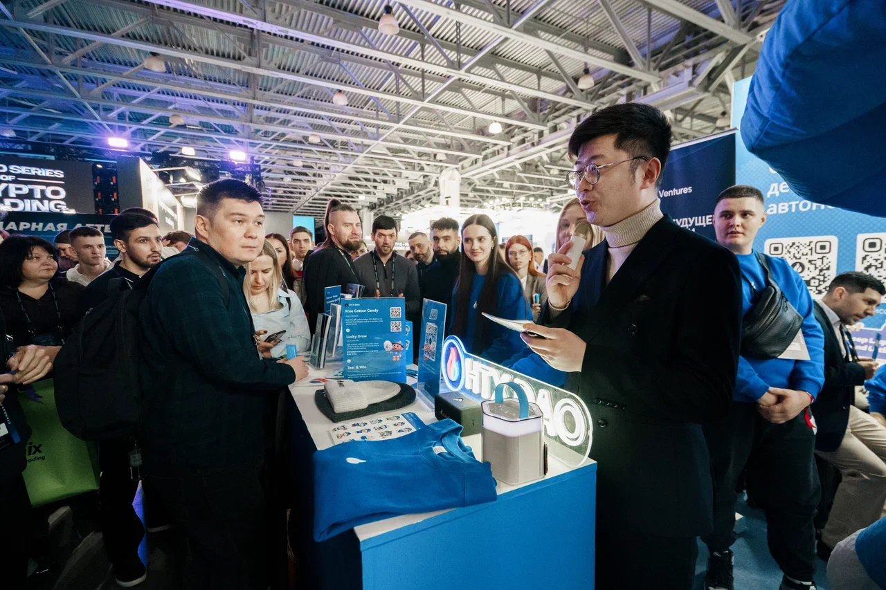 HTX DAO booth crowd and presentation